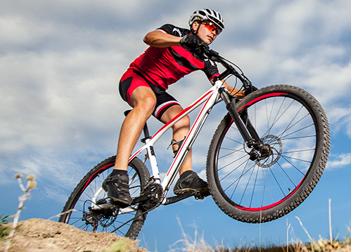 Outdoor_Home Spotlight_Mtn Bike Trails-Cyclist and Sky