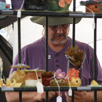 Man looking at crafts