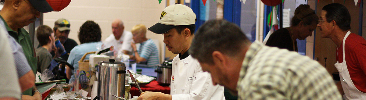 People in line being served food