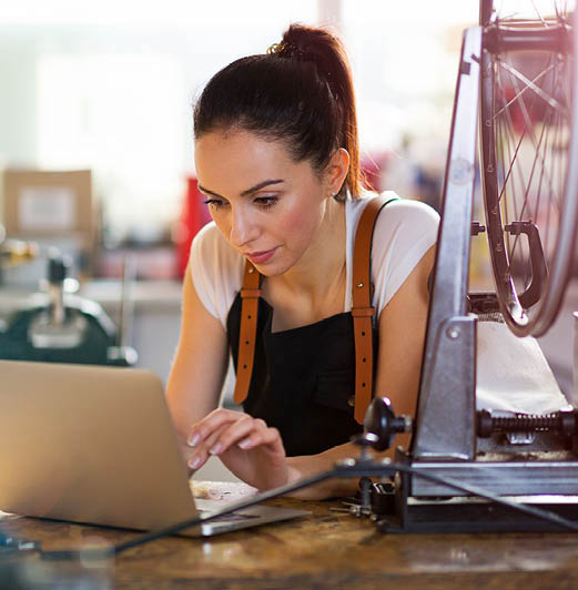 Woman typing on a lap top computer