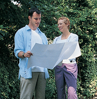 Man and woman looking at a blueprint