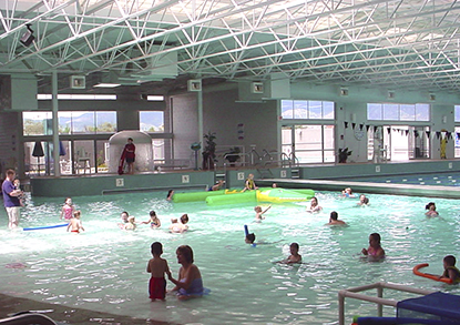 Children and adults in the swimming pool