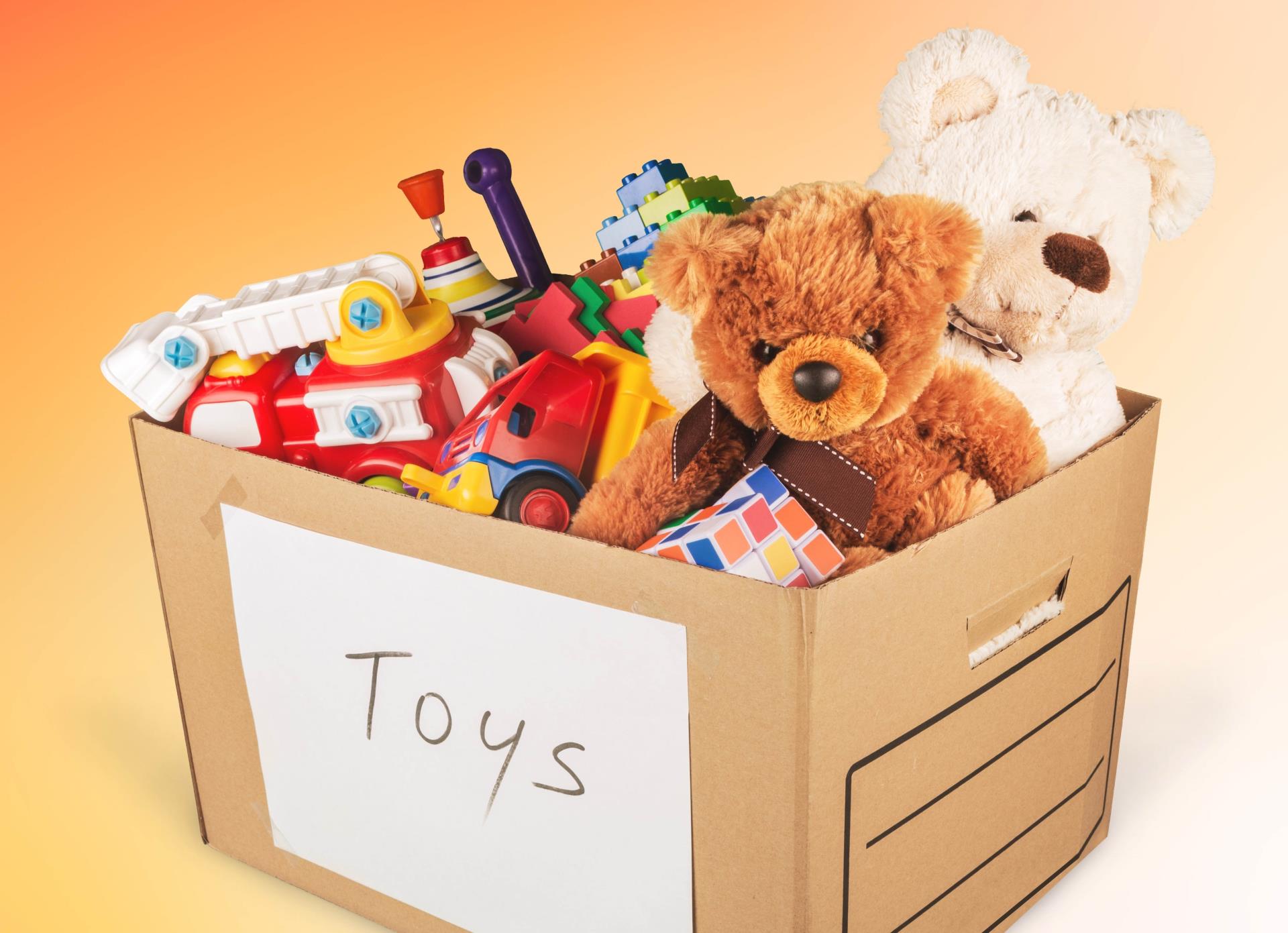 A cardboard box full of toys