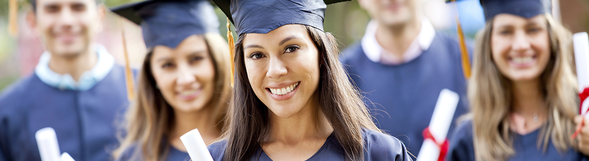 Graduates holding their diplomas