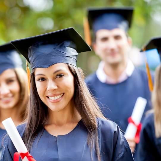 Graduates holding their diplomas