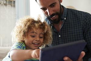 Man-and-child-with-eReader