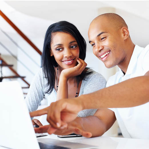 Woman and man looking at a computer screen